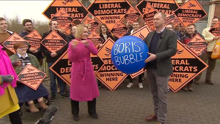 At a rally following their by-election win, the Liberal Democrats have given a more literal meaning to bursting the prime minister's bubble. 
Newly-elected North Shropshire MP Helen Morgan used a stick to burst a balloon that had the words 'Boris' bubble' scrawled across it, and was met with cheers from Lib Dem supporters.