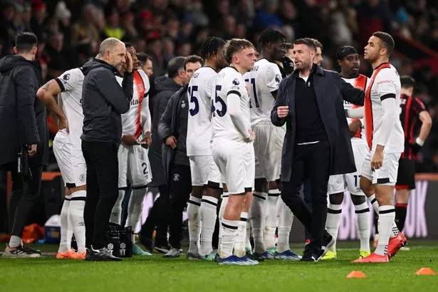 Bournemouth boss Rob Edwards enters the field of play after Tom Lockyer's injury