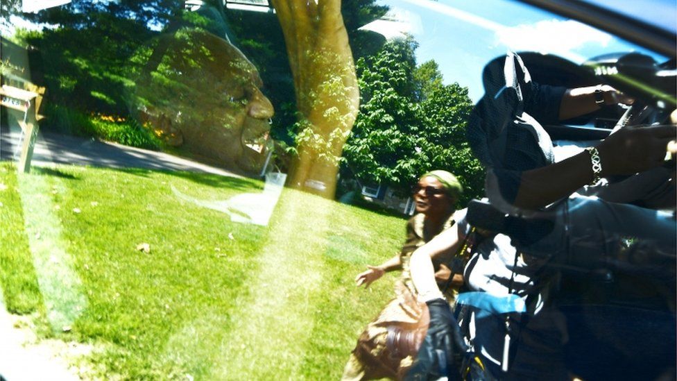 Bill Cosby sitting in a car